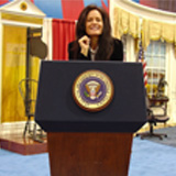 exhibitgirl-at-podium