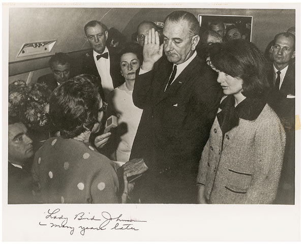Lyndon B. Johnson being sworn in aboard Air Force One